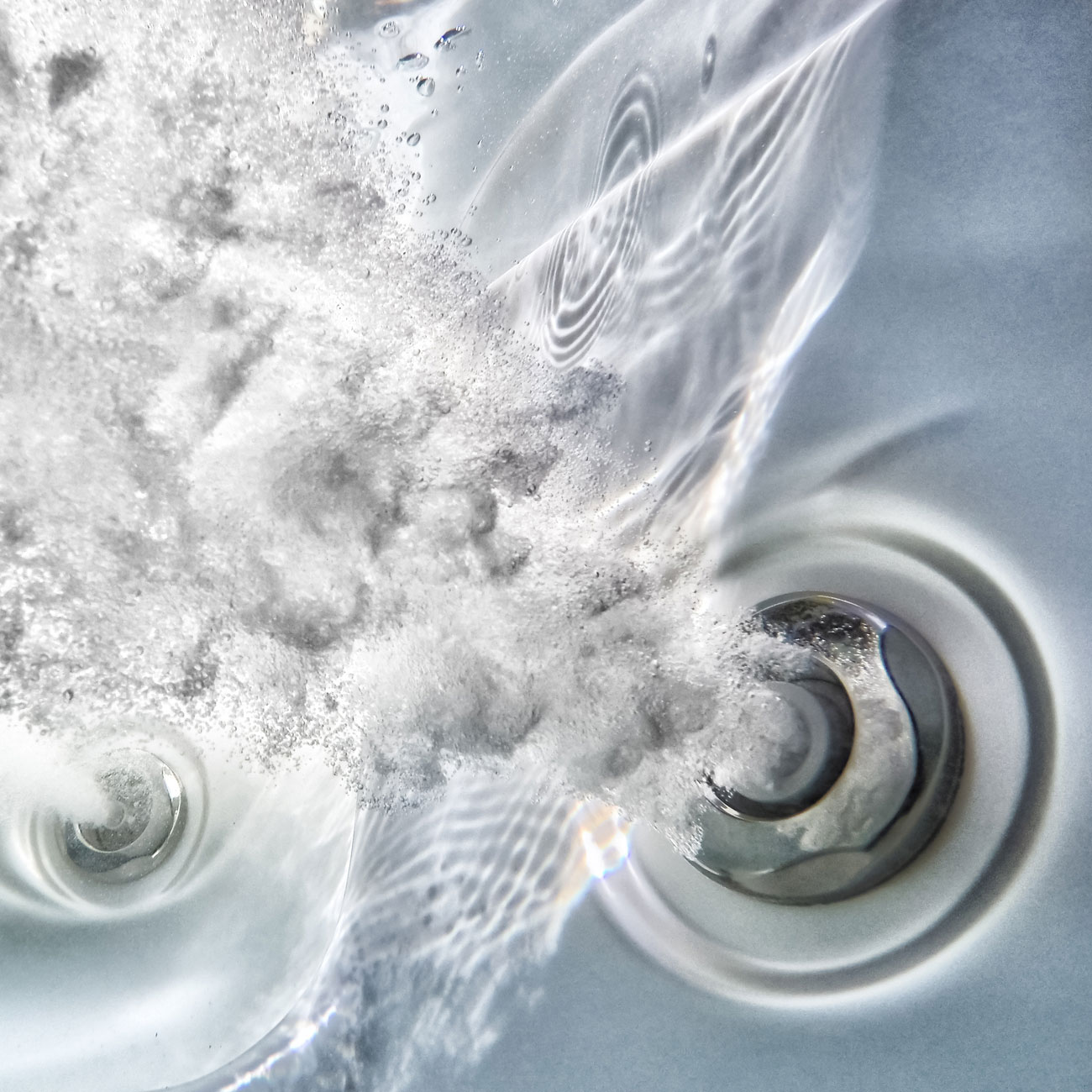 Example of tub's jet streaming out water and bubbles