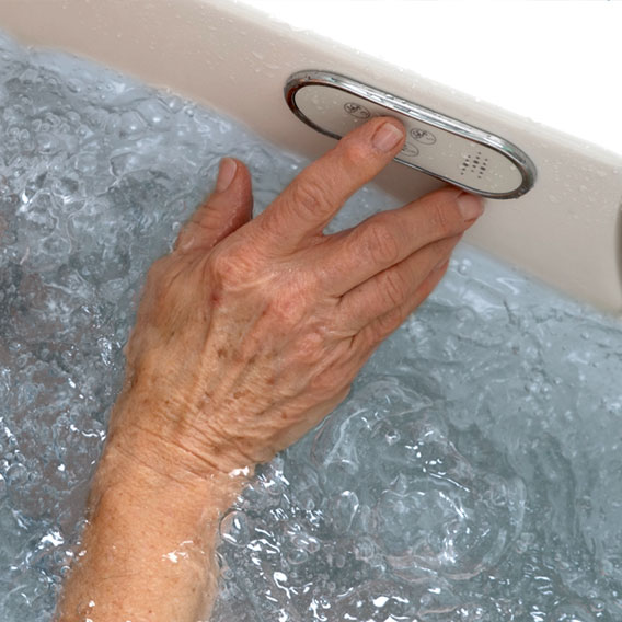 Photo of a hand as it navigates the user tub's user control interface