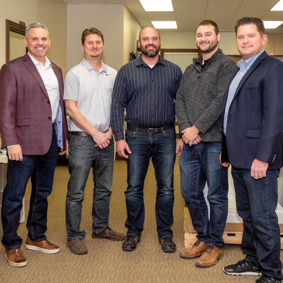 Five LHSS employees standing beside each other smiling