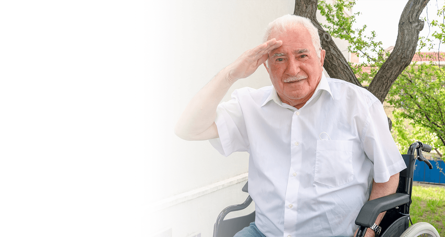 veteran saluting while in a wheel chair