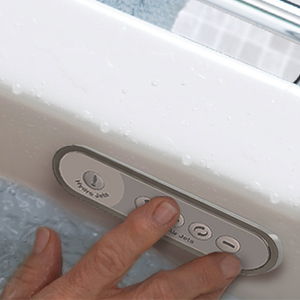 person's hand adjusting walk-in tub controls