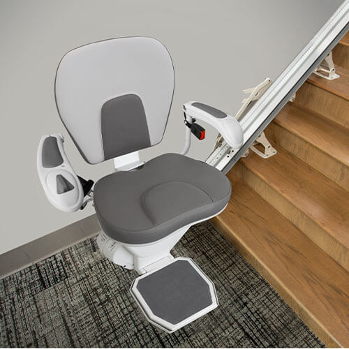 stair lift installed along wooden steps