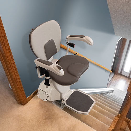 stair lift installed along wooden steps
